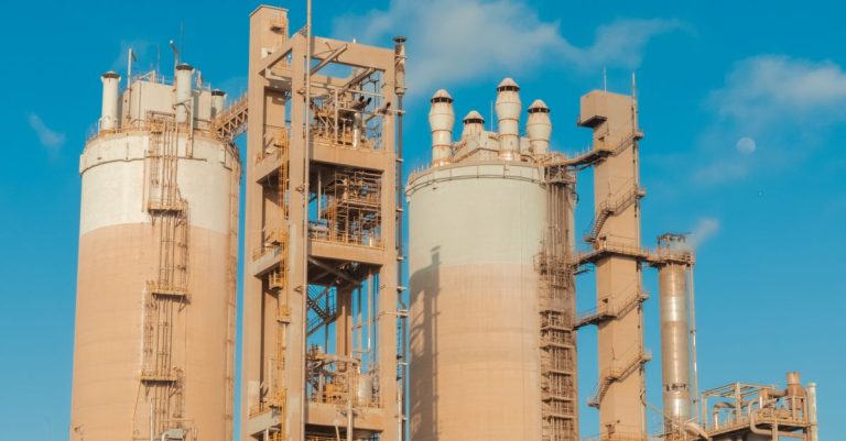 Urea production towers at an industrial fertiliser plant under a clear sky, illustrating Fertiglobe record H1 2026 dividend