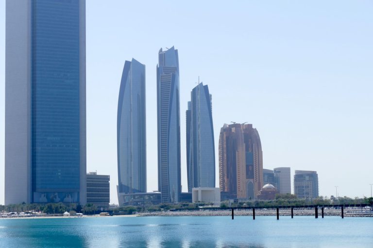 Abu Dhabi skyline with Etihad Towers, home of ADGM whose regulator FSRA signed a supervisory cooperation MoU with UAE gaming authority GCGRA in August 2026