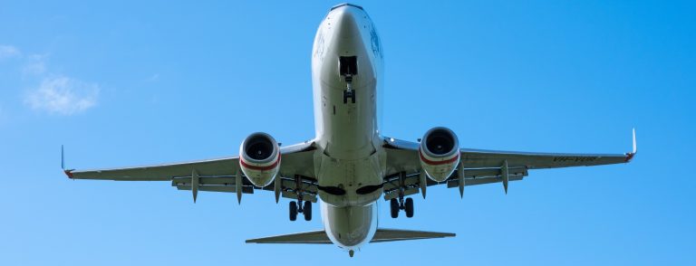 Boeing 737 seen from below climbing against a clear blue sky, illustrating the flydubai fleet expansion beyond 100 aircraft and the cabin retrofit programme announced on 15 September 2026