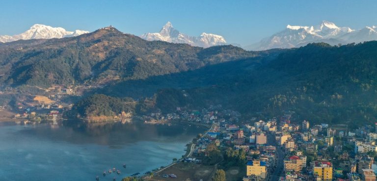 Aerial view of Pokhara in Nepal with Phewa Lake and the snow capped Annapurna range on the horizon