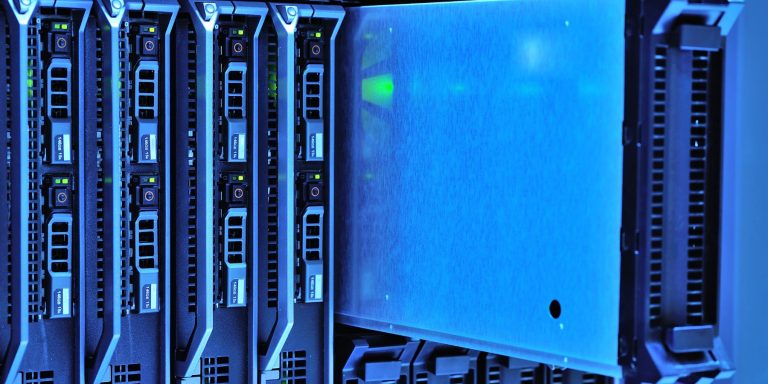Server racks in a data centre with blue lighting, illustrating the cloud infrastructure behind AI adoption by 72% of UAE businesses