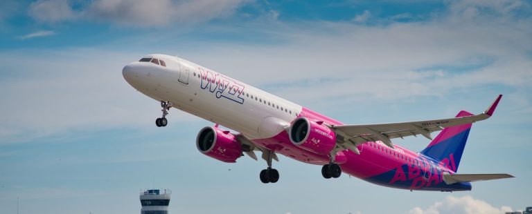 Wizz Air Airbus A321neo with Abu Dhabi titles taking off from a European airport: the airline returns to Dubai and Abu Dhabi from 25 October 2026