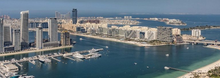 Aerial view of Dubai Marina towers and Palm Jumeirah, illustrating Dubai property transactions in Q3 2026