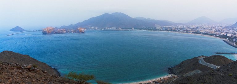 Aerial view of Khor Fakkan Port container terminal and bay on the Sharjah east coast, Gulf of Oman